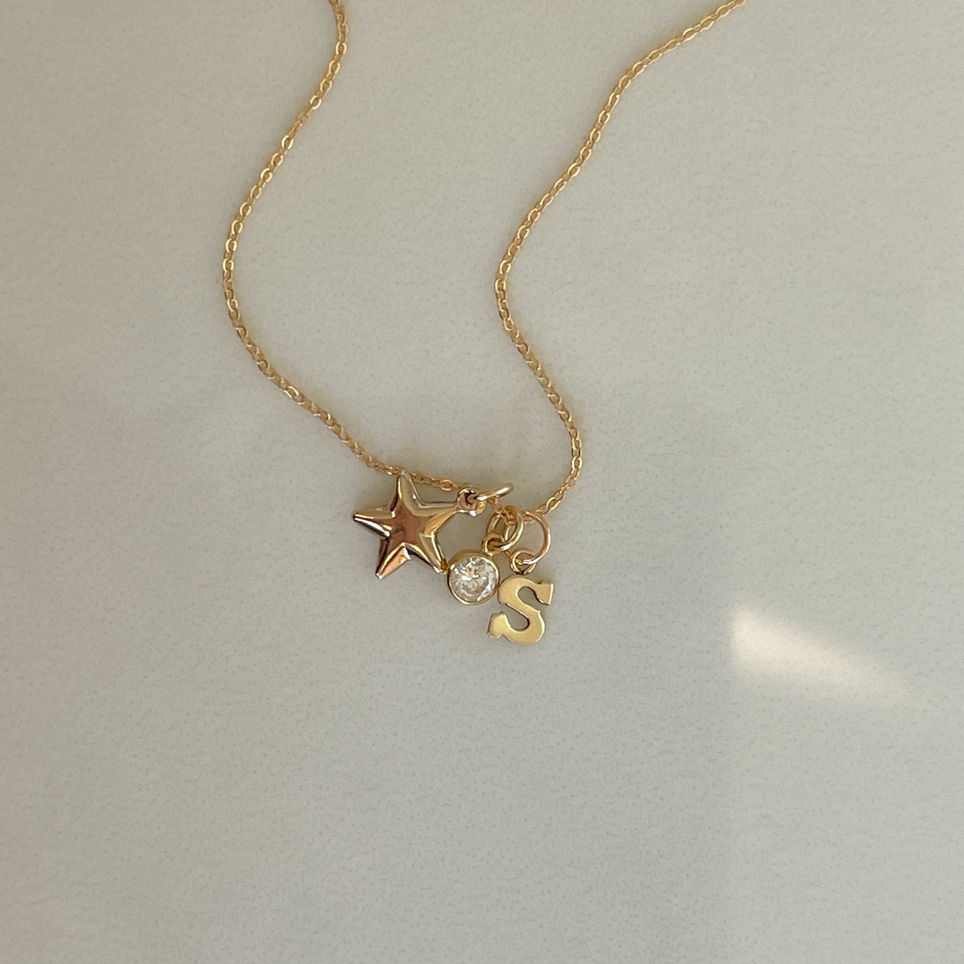 Gold filled Star Kissed necklace with double-sided heart star pendant and small CZ sparkle